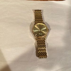 Gold Accutime watch